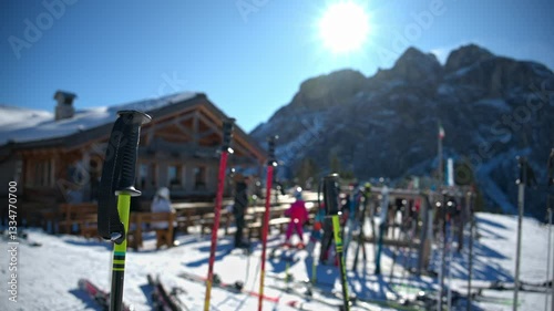 Wallpaper Mural Close up of ski poles and equipment gathered at a ski resort with the mountains in the background Torontodigital.ca