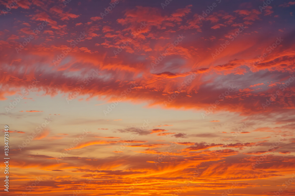 Obraz premium Stunning Vibrant Sunset with Orange and Red Sky