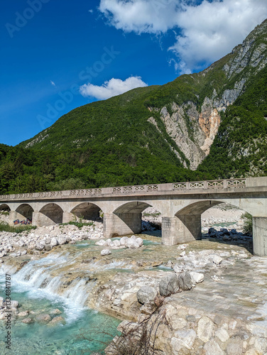 Soca Valley, Slovenia – Aerial view of the emerald-green Alpine River Soca on a bright sunny summer day with green foliage..The last wild river in Europe in Triglav National Park near the Vricic Pass