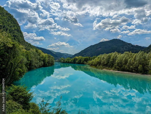Soca Valley, Slovenia – Aerial view of the emerald-green Alpine River Soca on a bright sunny summer day with green foliage..The last wild river in Europe in Triglav National Park near the Vricic Pass