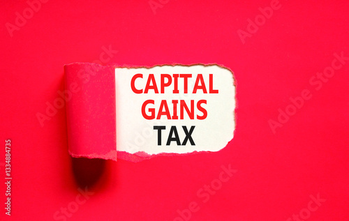 Capital gains tax symbol. Concept words Capital gains tax on beautiful white paper. Beautiful red paper background. Business and capital gains tax concept. Copy space.