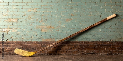 Vintage Hockey Stick Leaning Against Rustic Brick Wall, Sports Memorabilia, Texture
