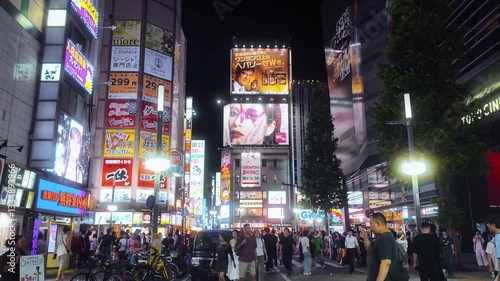 Shinjuku, Tokyo, Japan - August 15 2024: Kabukicho street at night. The iconic red neon Kabukicho gate sign