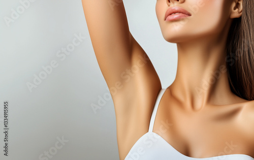Young woman holding her arms up and showing underarms, armpit smooth clear skin .Girl showing clean armpit .Beauty portrait.Epilation and depilation of hair . 