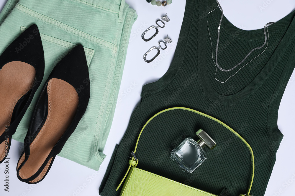 Fototapeta premium Stylish women's clothes and different accessories on white background, flat lay