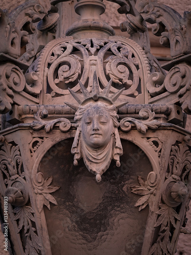 Lady Liberty figurehead on ornamental lantern