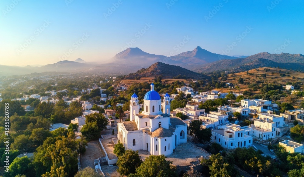 Naklejka premium Aerial view of greek orthodox church with blue domes in serene village landscape.