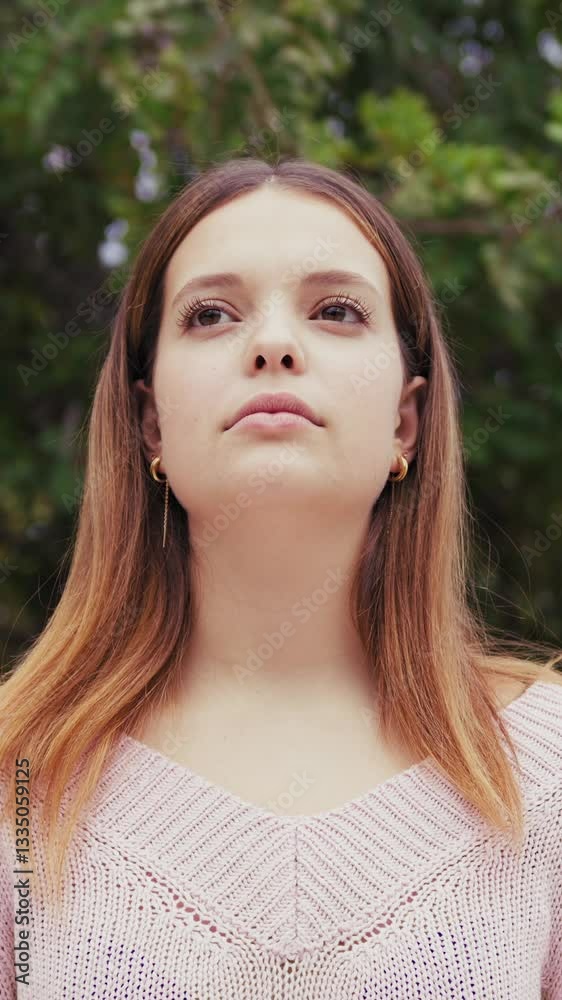 Serious And Indifferent Girl In Front Of People Passing Apathy Concept Serious And Indifferent Girl In Front Of People Passing Apathy Concept