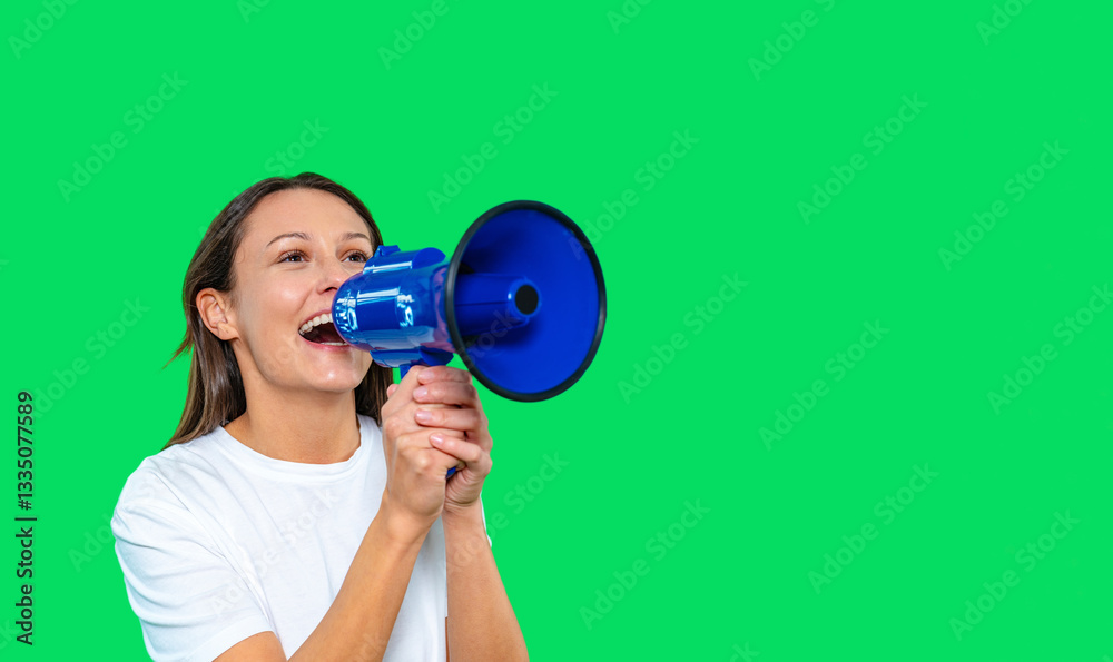 Obraz premium Person holding a megaphone enthusiastically speaking against a bright green backdrop during an outdoor event or rally