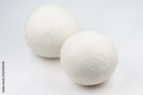 Wool dryer balls on white background.