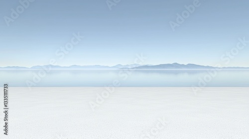 A serene landscape of a calm body of water, mountains, and a sandy beach.