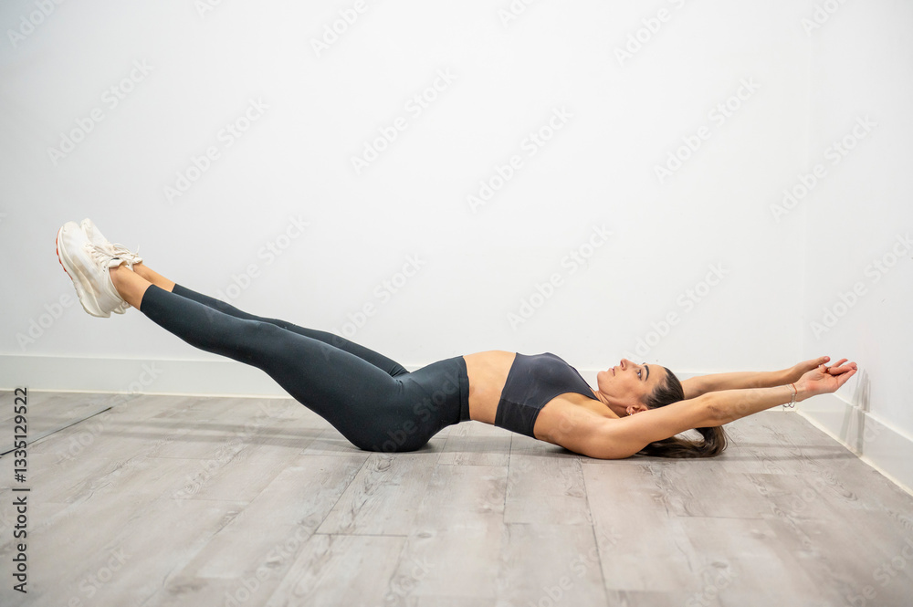 Hollow body hold exercise to strengthen core muscles, stability, and improve full-body control Hollow body hold exercise to strengthen core muscles, stability, and improve full-body control