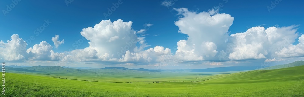Xinjiang grassland scenery with wide green field, blue sky, white clouds. Panoramic view of vast pasture landscape. Summer day outdoor in valley with mountain horizon. Popular travel destination. Xinjiang grassland scenery with wide green field, blue sky, white clouds. Panoramic view of vast pasture landscape. Summer day outdoor in valley with mountain horizon. Popular travel destination.