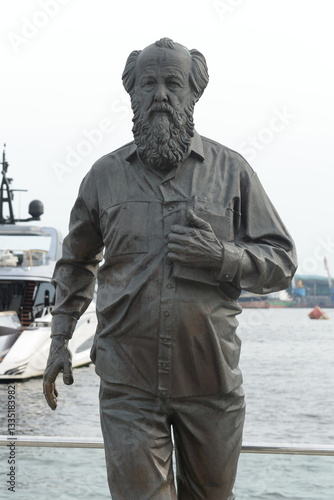 Monument to the writer Alexander Solzhenitsyn on the embankment in Vladivostok photo