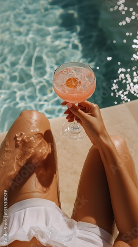 Relaxing by the Pool With a Refreshing Cocktail on a Sunny Day