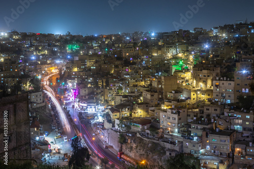 Fototapeta Naklejka Na Ścianę i Meble -  Night panorama of Amman city downtown with lots of glowing streets and highlighted houses, Kingdom of Jordan