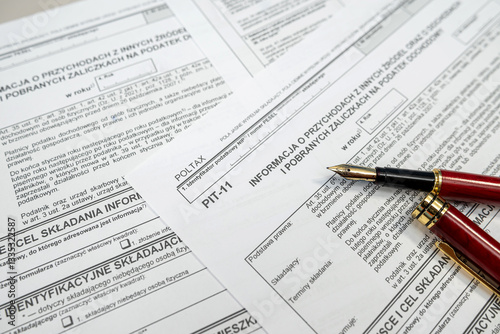PIT-11 polish tax form on accountant table with pen close up. Tax time