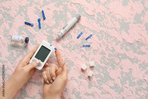 Diabetic woman using glucom...