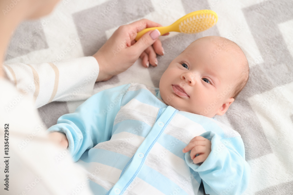 Mother brushing little baby's head with cradle cap on bed, closeup Mother brushing little baby's head with cradle cap on bed, closeup