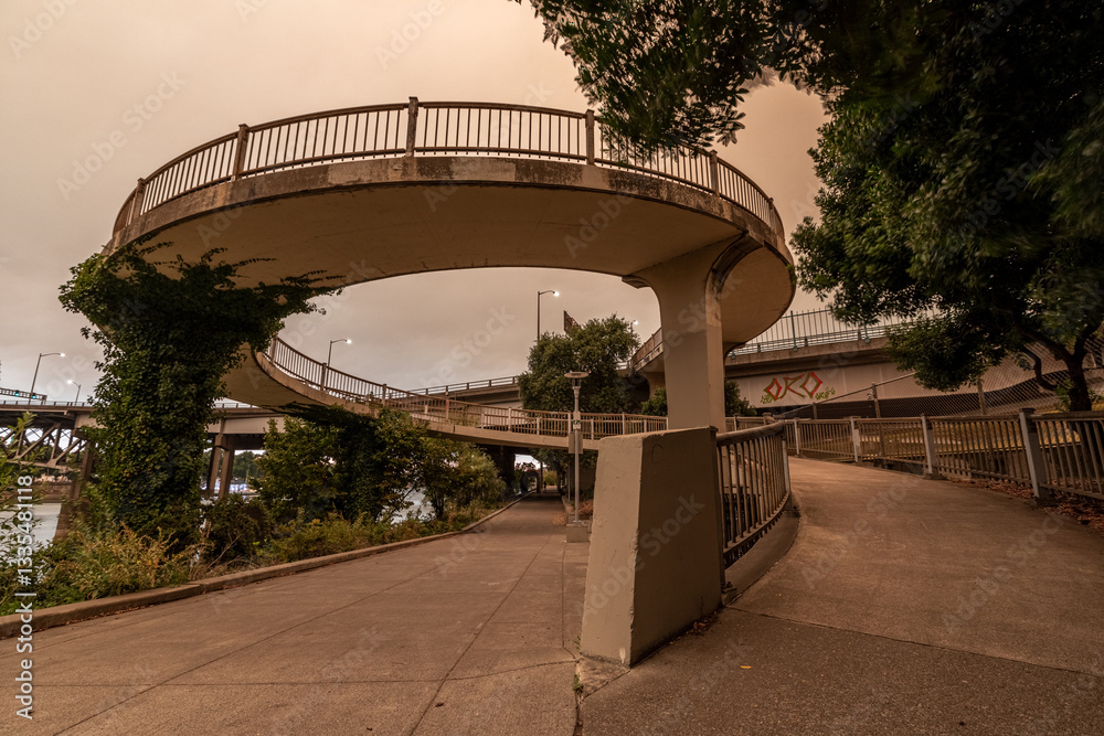 Dramatic smoky sky over Portland’s Eastbank near I-5, showing an urban walkway wrapped in wildfire haze. The thick pollution from 2020’s fires altered the city’s air quality Dramatic smoky sky over Portland’s Eastbank near I-5, showing an urban walkway wrapped in wildfire haze. The thick pollution from 2020’s fires altered the city’s air quality
