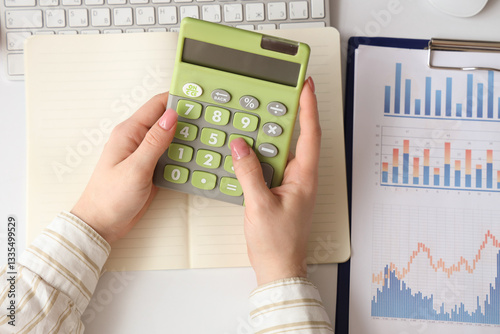 Female accountant with calc...