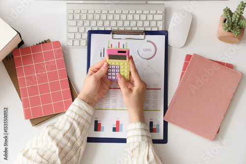 Female accountant with calc...