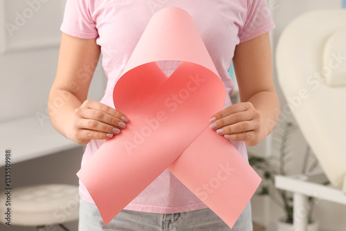 Wallpaper Mural Young woman with pink ribbon in clinic, closeup. Breast cancer awareness concept Torontodigital.ca