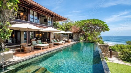 Wallpaper Mural Exclusive beach resort villa with a private infinity pool, elegant decor, and ocean views. Torontodigital.ca