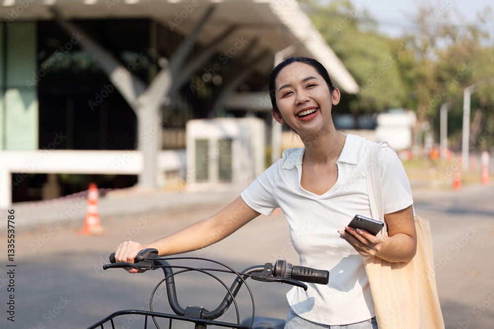 Cycling and Digital Connectivity. A woman enjoying her bicycle ride while checking her phone. Cycling and Digital Connectivity. A woman enjoying her bicycle ride while checking her phone.