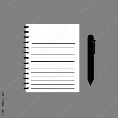 paper notebook and pen on gray background