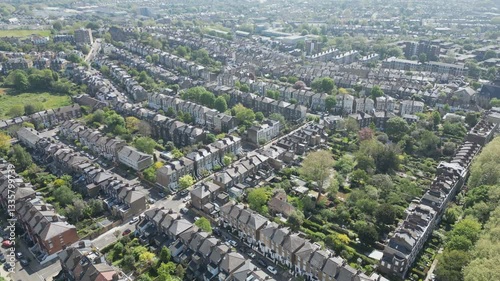 Aerial drone video of dense rows of British terraced houses.