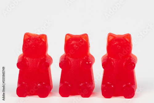 Homemade red gummy bear candy isolated on white background photo