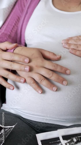 Wallpaper Mural Pregnant couple of husband and wife feels love and relax at home. Young expecting woman holds baby in pregnant belly. Father take care of pregnant mother. Concept of maternity and pregnancy care. Torontodigital.ca