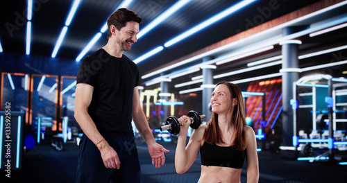 Strong Female Athlete Gets Motivation From Personal Trainer
