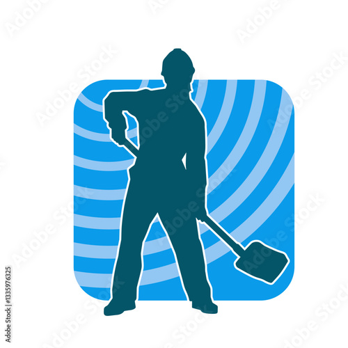 Silhouette of a worker carrying shovel tool. Silhouette of a worker in action pose using shovel tool.