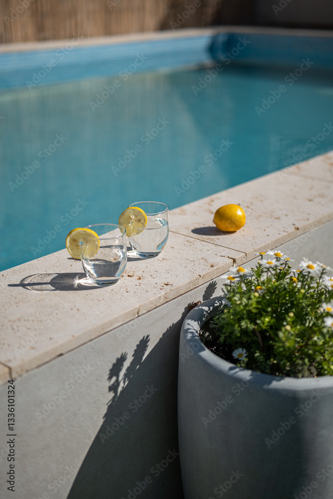 custom made wallpaper toronto digitalRefreshing poolside scene with two glasses of water garnished with lemon slices on a stone ledge