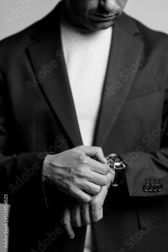 business man holding his watch