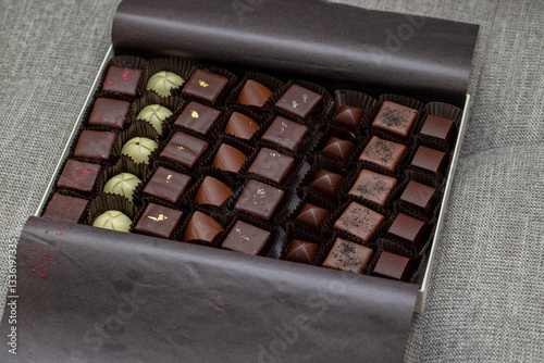 Assorted Chocolates Confectionery in a Gift Box with a ribbon. Luxury chocolate in a box. Valentines Day Gift Chocolate Box