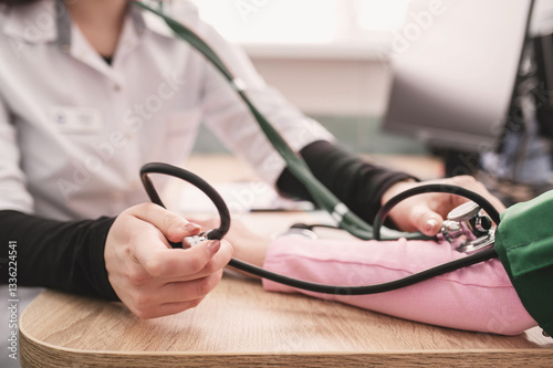 close-up image of doctor using sphygmomanometer tonometer to measure patient's blood pressure. Medical procedure, showing the arm cuff and stethoscope. No face
Preventing Hypertension: no stress