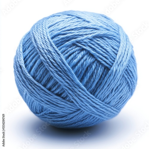 A ball of blue yarn sits alone. It looks soft and is on a plain white surface.