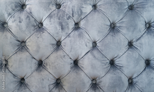 Quilted vintage sofa velour fabric, vintage upholstered furniture, soft gray fabric sofa with sewn-in buttons texture, background
