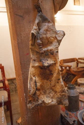 Old ancient winesking bag for wine hanging on the wall