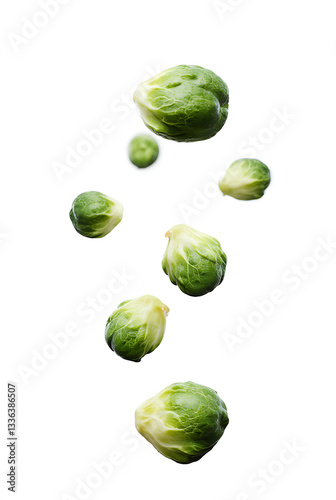 Fresh brussels sprouts floating in mid-air against a white background showcasing natural textures and colors