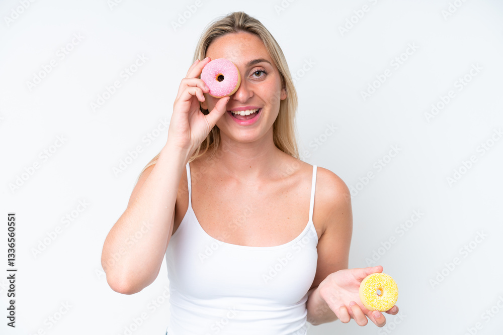 Young caucasian woman isolated on white background holding a donut and happy Young caucasian woman isolated on white background holding a donut and happy