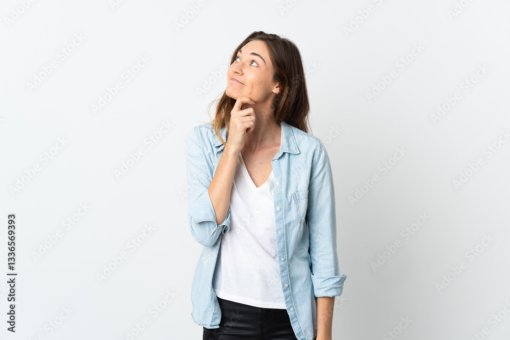 Young Ireland woman isolated on white background looking up while smiling Young Ireland woman isolated on white background looking up while smiling
