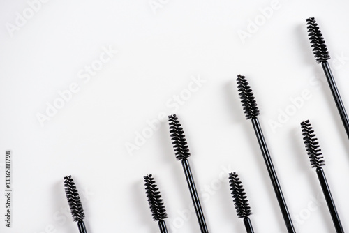 Group of black brushes for eyelash and eyebrow makeup. Women beauty and eye makeup.