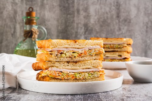 Obraz na płótnie Gilgeori toast with cabbage, carrot, ham and cheese on a plate on the table w salonie