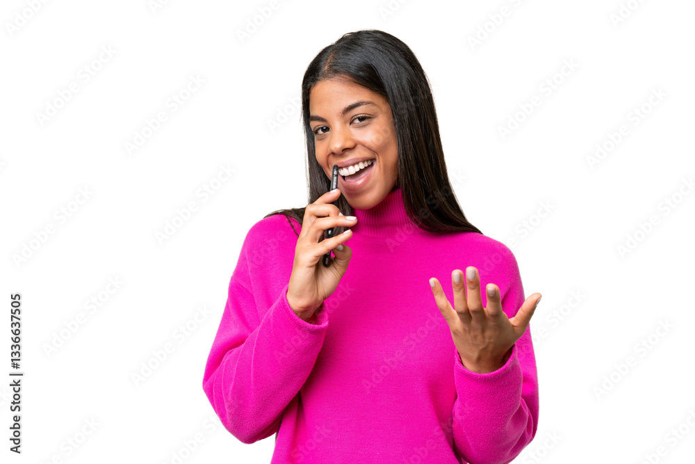 Young African American woman over isolated background using mobile phone and singing Young African American woman over isolated background using mobile phone and singing