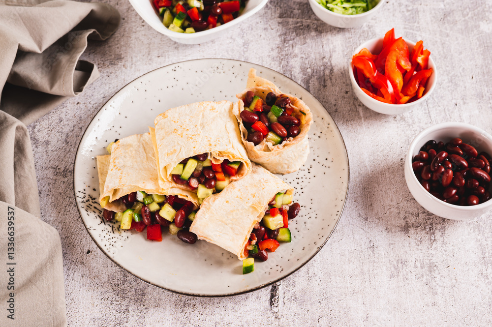 Vegetarian salsa rolls in tortilla on plate on table