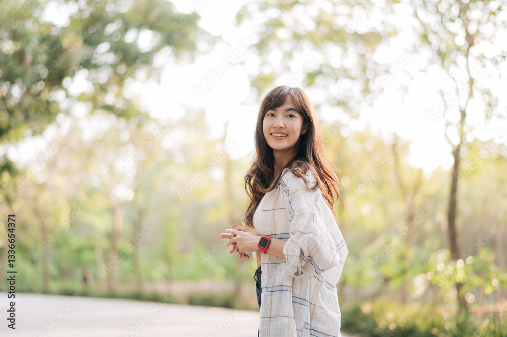 Asian woman enjoying summer outdoors, breathing fresh air with joyful smile, surrounded by lush greenery and sunlight Asian woman enjoying summer outdoors, breathing fresh air with joyful smile, surrounded by lush greenery and sunlight
